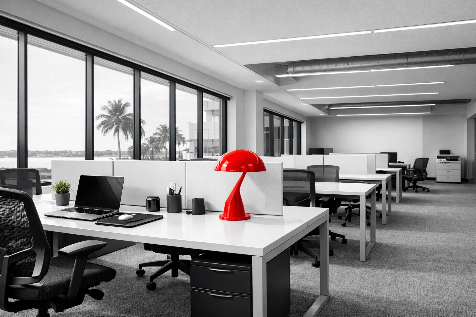 Clean and modern office cleaning Port Charlotte with desks prepared for a flexible hybrid work schedule.